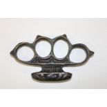 A heavy cast vintage knuckle duster