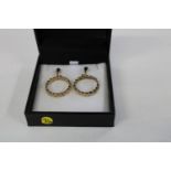 A pair of heavy 9ct gold loop drop earrings