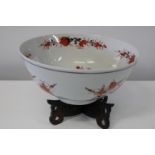 A Chinese Imari pattern bowl on a wooden stand d36cm