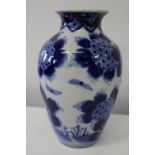 An antique 19th century Chinese porcelain blue & white vase with slight restoration to rim. h32cm