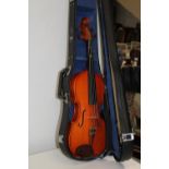 A cased violin & bow
