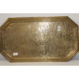 An antique embossed brass Tibetian tea tray w64cm