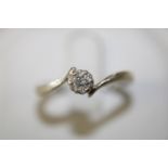 A 9ct white gold diamond solitaire ring size 0 1/2