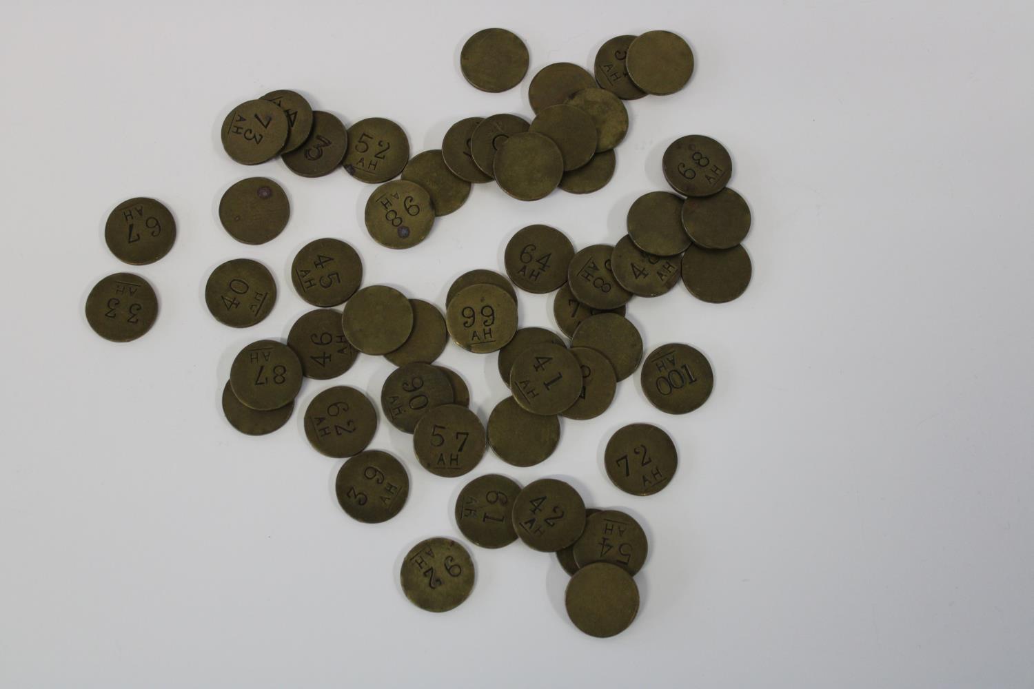 A collection of fifty four AH brass tokens