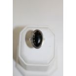 A Sterling silver and black stone dress ring