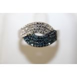 A 925 silver dress ring with blue & white diamonds (with COA) size S