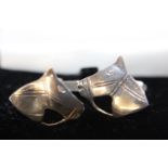 A pair of white metal horse related cufflinks
