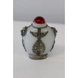 A hand decorated Tibetian scent bottle h10cm
