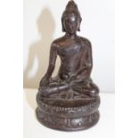 A Chinese bronze sitting Budha figure. 13cm tall