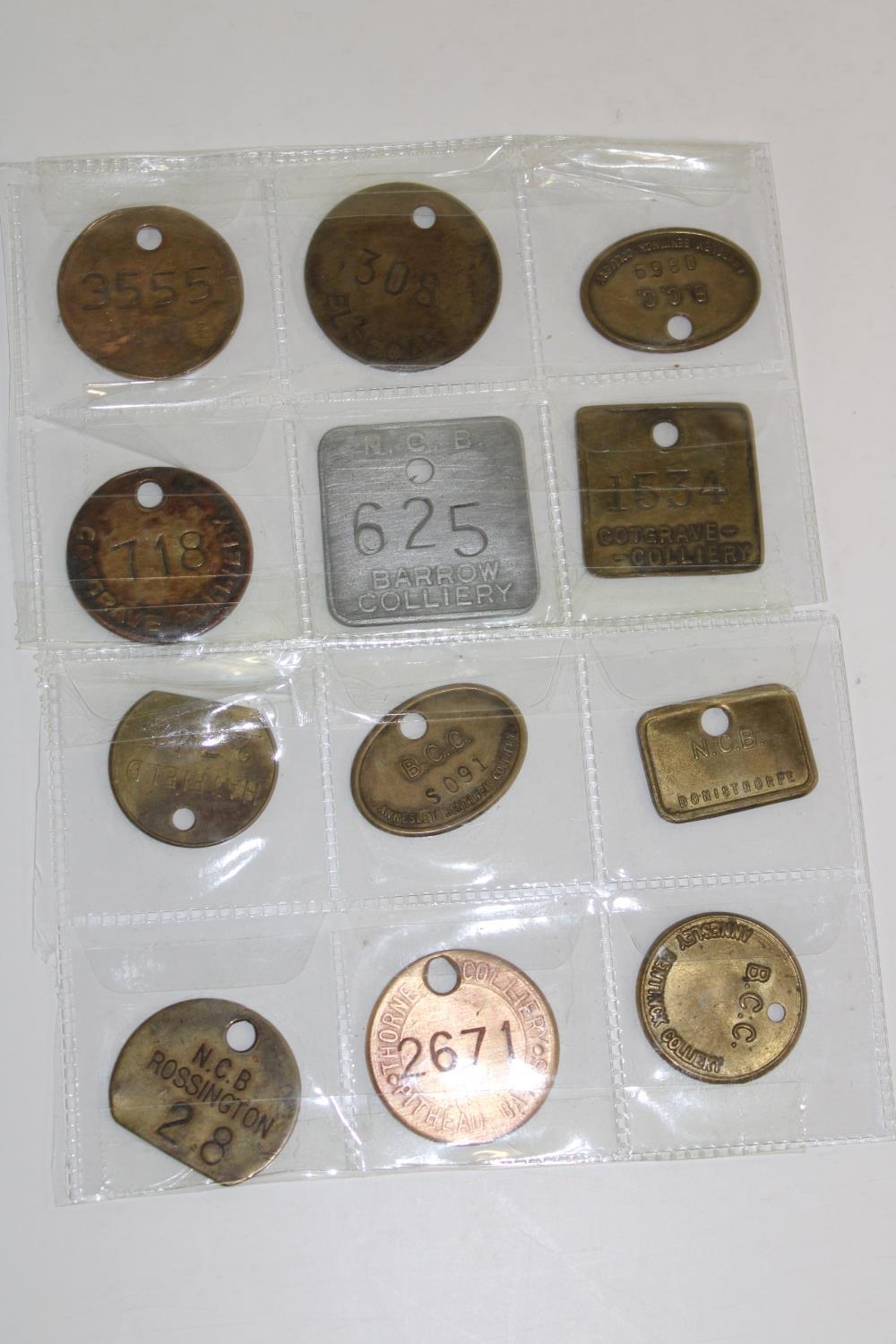 Twelve assorted colliery miners pit tokens