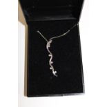 A 9ct white gold & diamond necklace