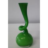 A collectable Normann glass swing vase with original label. 19cm tall