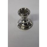 A hallmarked silver candlestick