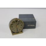 A vintage Cyma travel alarm clock