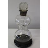 A hallmarked silver collared decanter (chip to stopper & flaw to decanter)