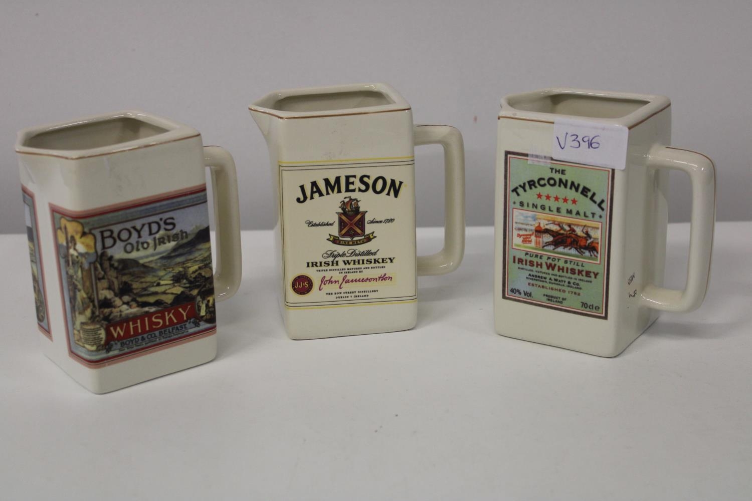 Three collectable vintage whisky water jugs