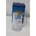 A collectable etched glass tankard