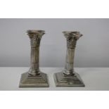 A pair of Victorian candlesticks hallmarked for Chester 1898 (slight damage to one)