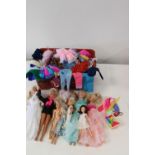 A job lot of vintage Barbie dolls & outfits