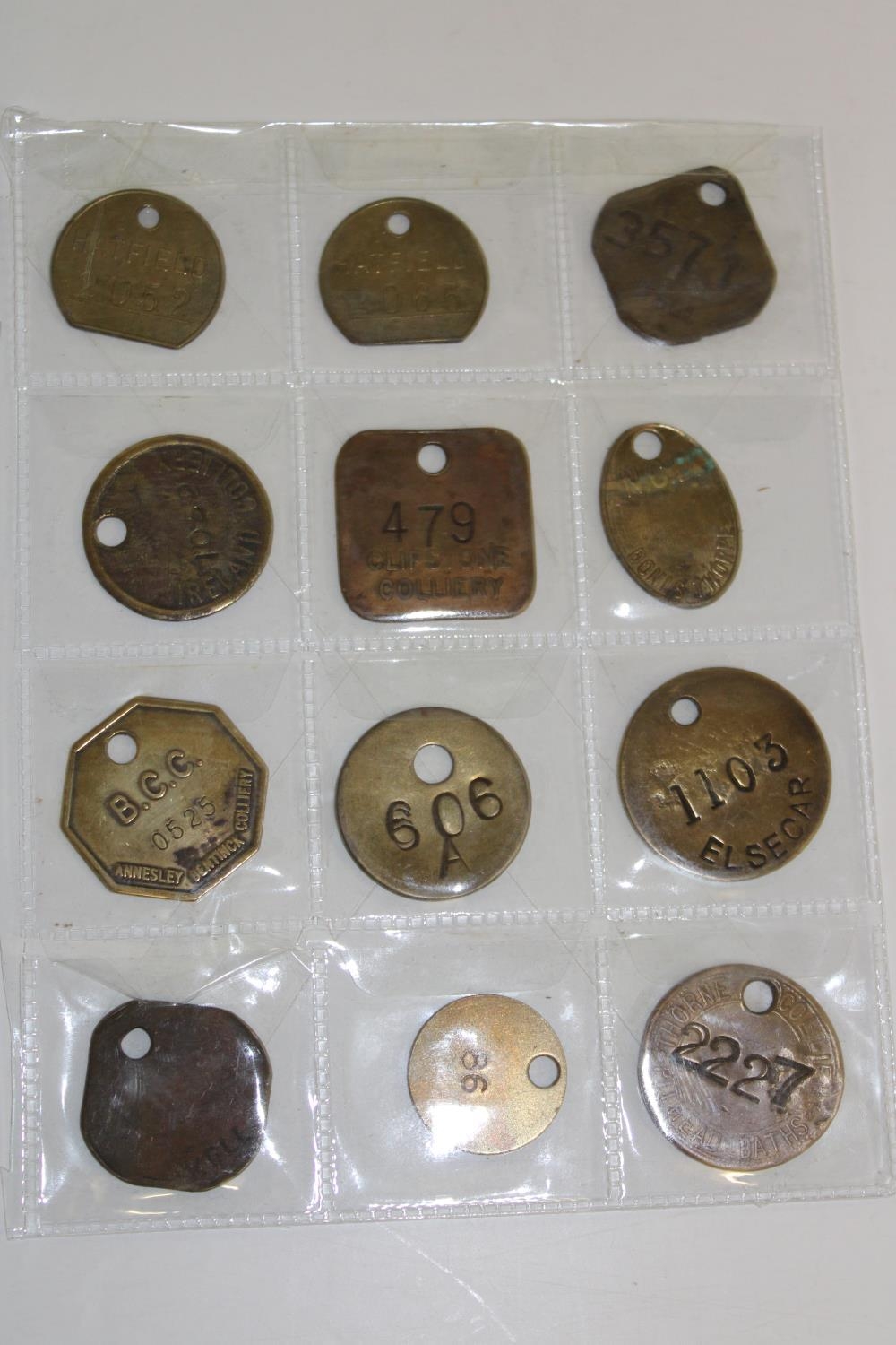 Twelve assorted colliery miners pit tokens