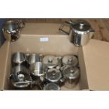 A box of stainless steel jugs & pots etc