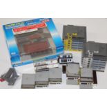 A box of Marklin and Prmloco, Z gauge model railway buildings.