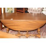 An Ercol drop leaf coffee table Collection Only. 1.05 metres x 0.90 meters with leaves extended