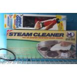 A boxed steam cleaner & Hydro pump