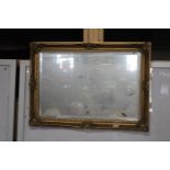 A vintage bevelled edged glass mirror 90cm x 63cm Collection Only