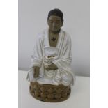 A ceramic Chinese Budhist figure