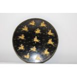 An Islamic lacquered plate d26cm