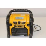 A working Dewalt site radio with battery charging point