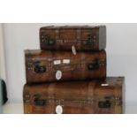 Three stackable wooden decorative suitcases (largest 60x36cm)