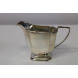 A stamped silver jug (162 grams)