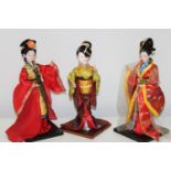 Three Japanese doll figures