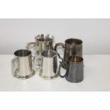 A selection of silver plated tankards