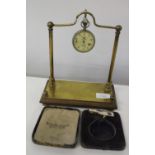 A vintage pocket watch and stand (watch not working)