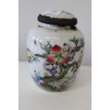 A Chinese vase/cannister with peach tree decoration & marks to base (cannister is sealed)
