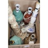 A box of assorted ceramic table lamps