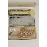 A selection of boxed vintage necklaces etc