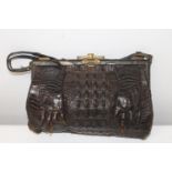 A vintage crocodile skin handbag