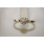 A 9ct gold daisy cluster ring size N 1/2