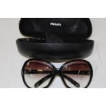 A pair of genuine Prada oversized sunglasses in original case