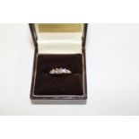 A 14ct white gold & three stone diamond ring size N 1/2