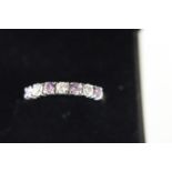 A 9ct gold amethyst & white stone half eternity ring size Q