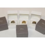 Three boxed Dior rings
