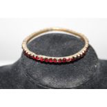 A gilt metal & garnet bracelet