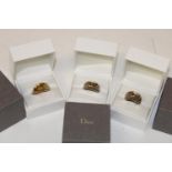 Three boxed Dior rings