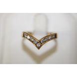 A 9ct gold wishbone ring size Q