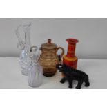 A shelf of collectables including a quality cut glass claret decanter